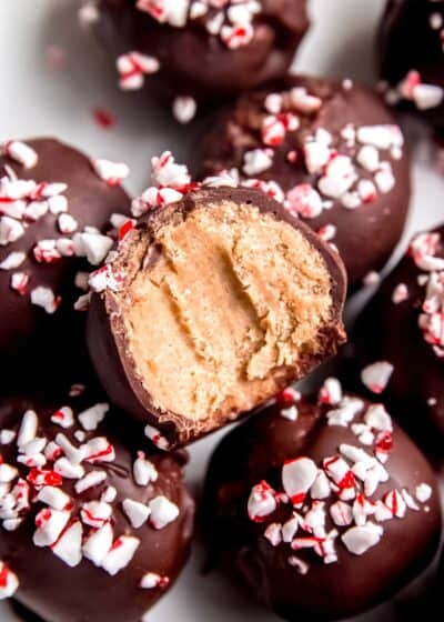 close up image of a stack of peppermint mocha truffles with a bite missing from one truffle