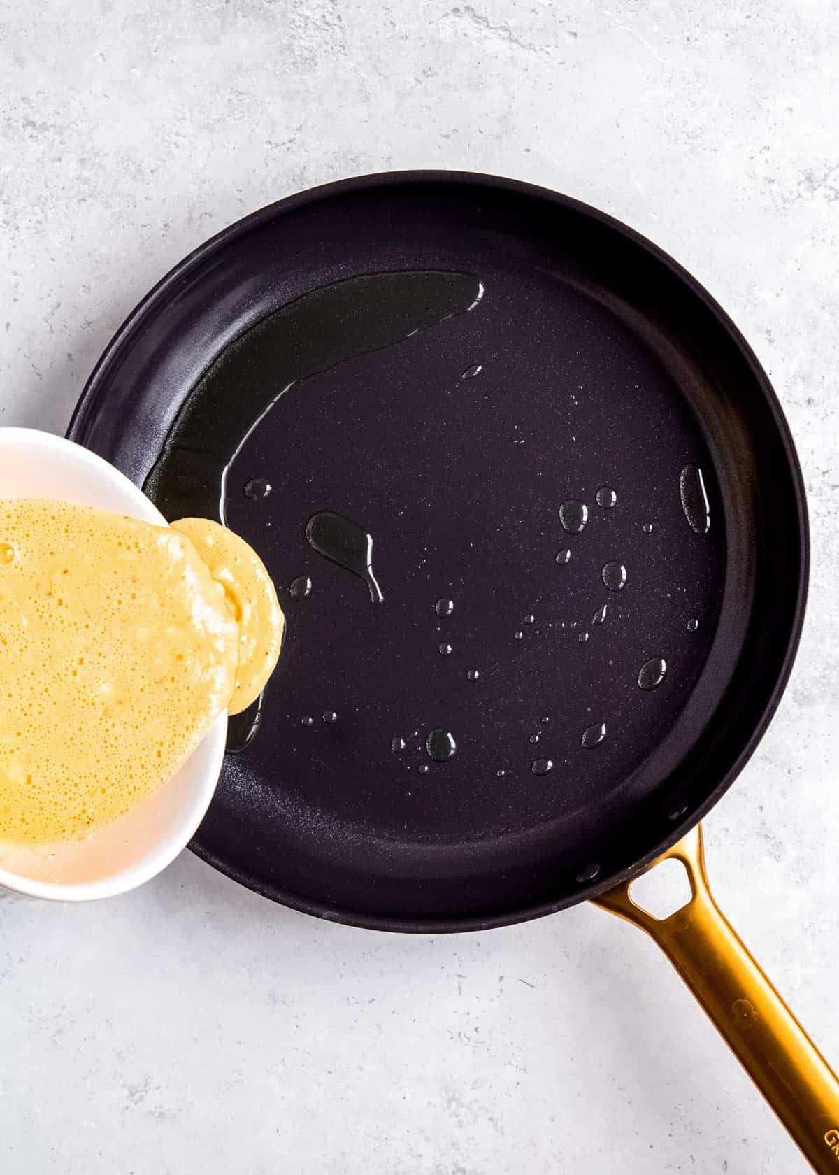 eggs being poured in skillet