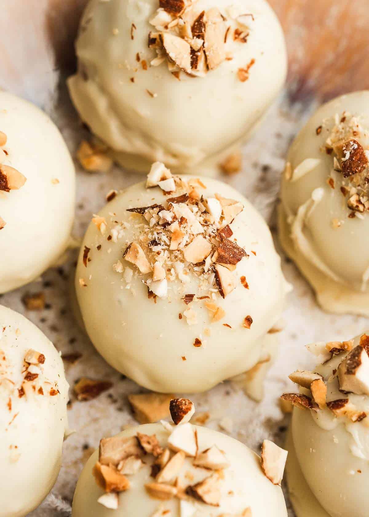 close up, overhead image of an almond butter truffle on a white table