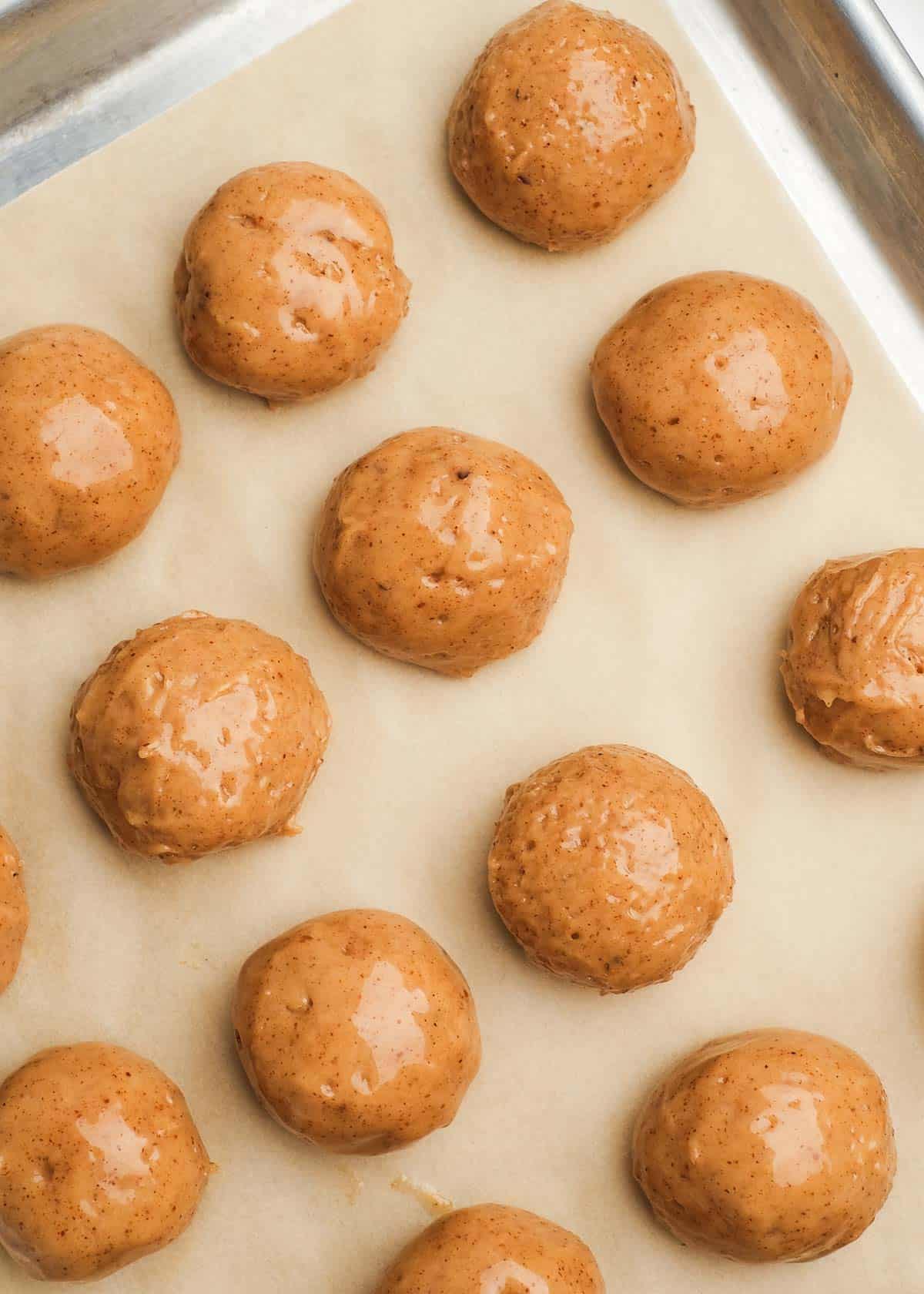 close up of almond butter truffle filling rounded out on sheet pan