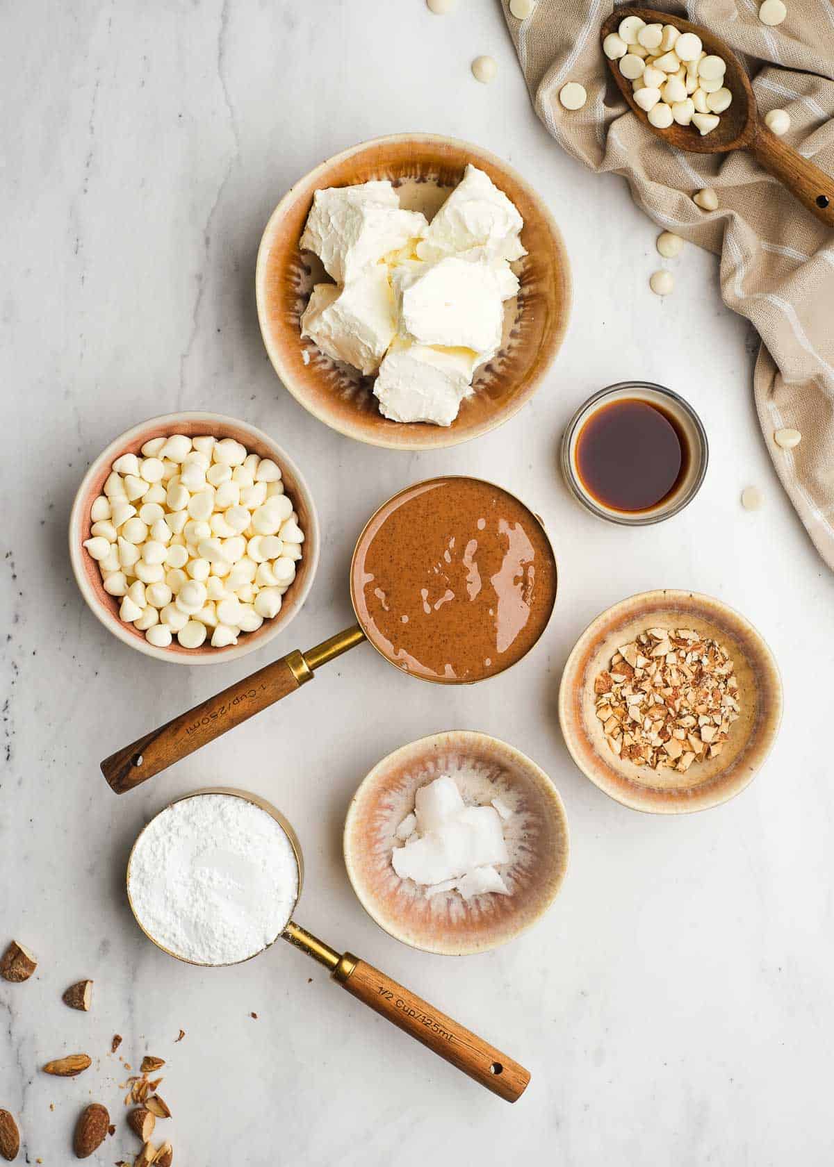 almond butter truffle ingredients on a white table 