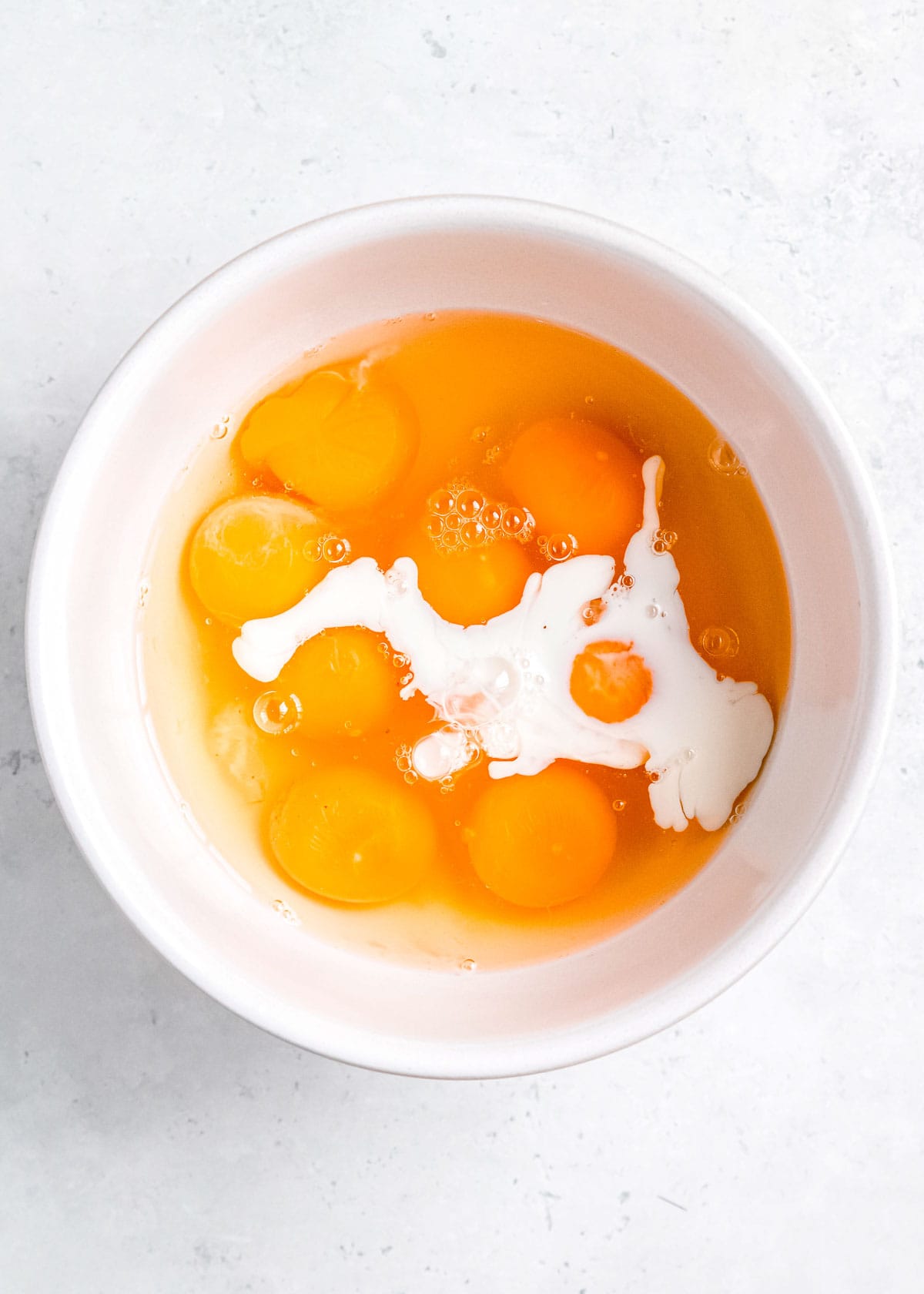 eggs in a white mixing bowl