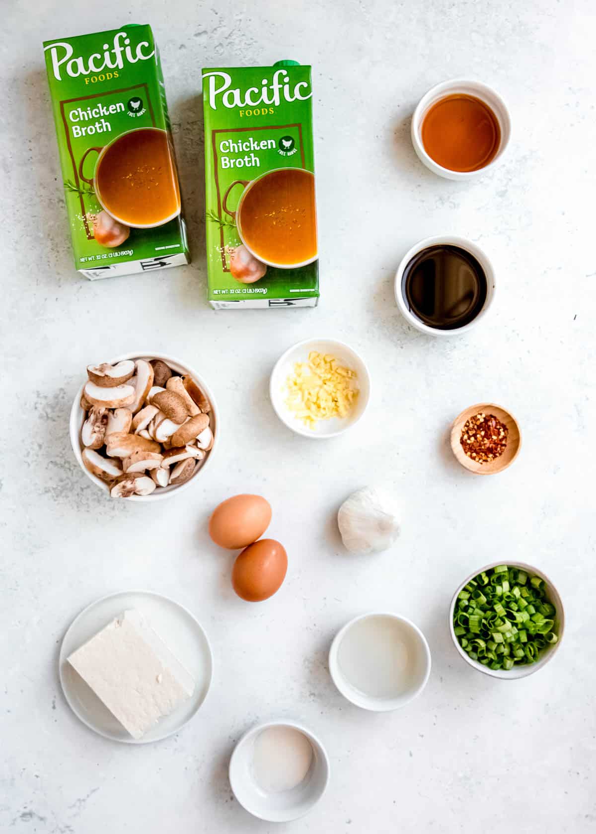 hot and sour soup ingredients on a white table