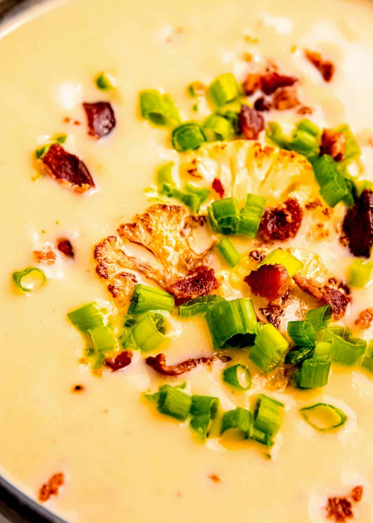 close up image of loaded cauliflower soup