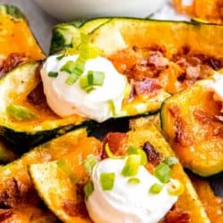 close up, overhead image of two loaded zucchini skins
