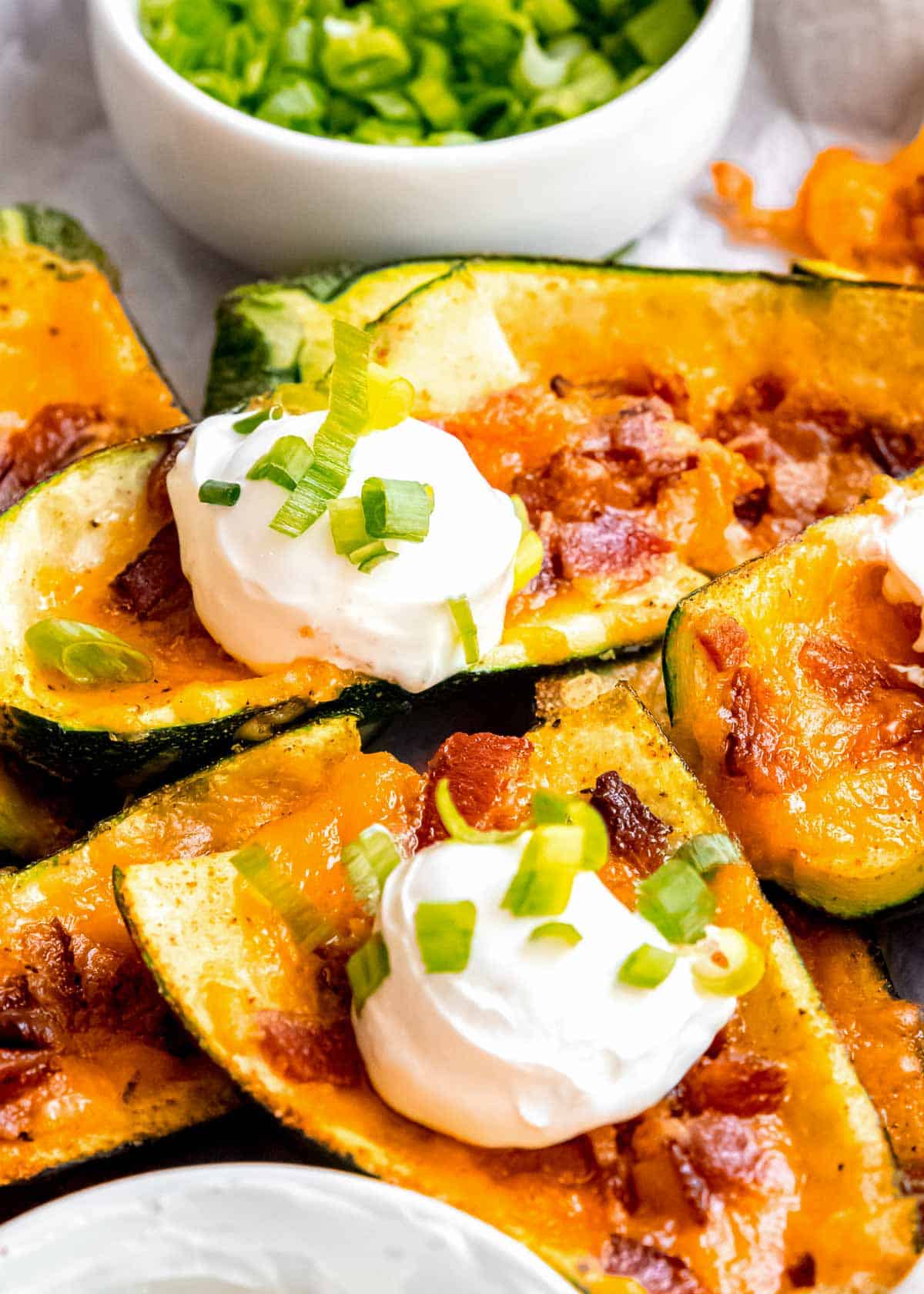 close up, overhead image of two loaded zucchini skins