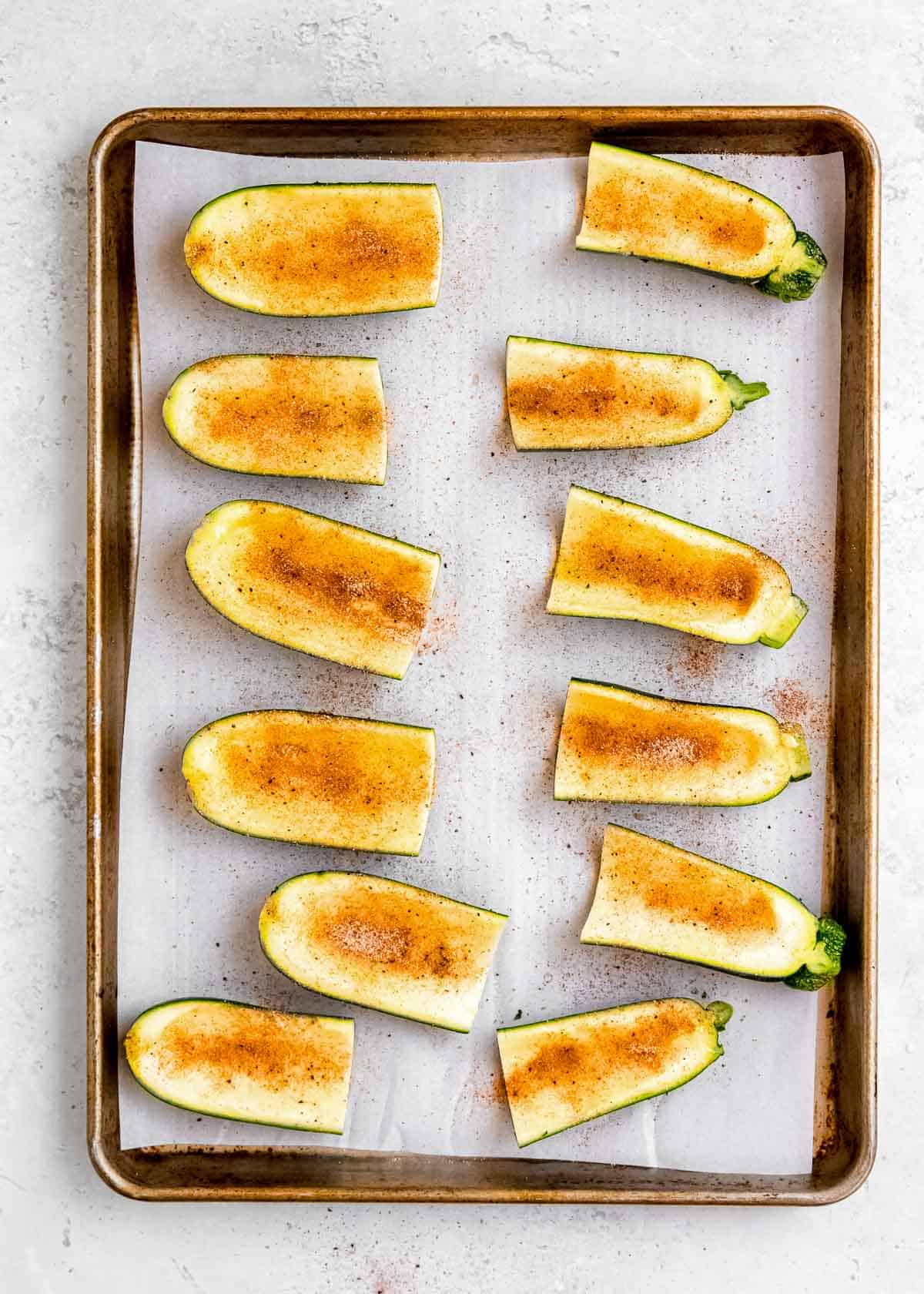 seasoned zucchini skins on a sheet pan
