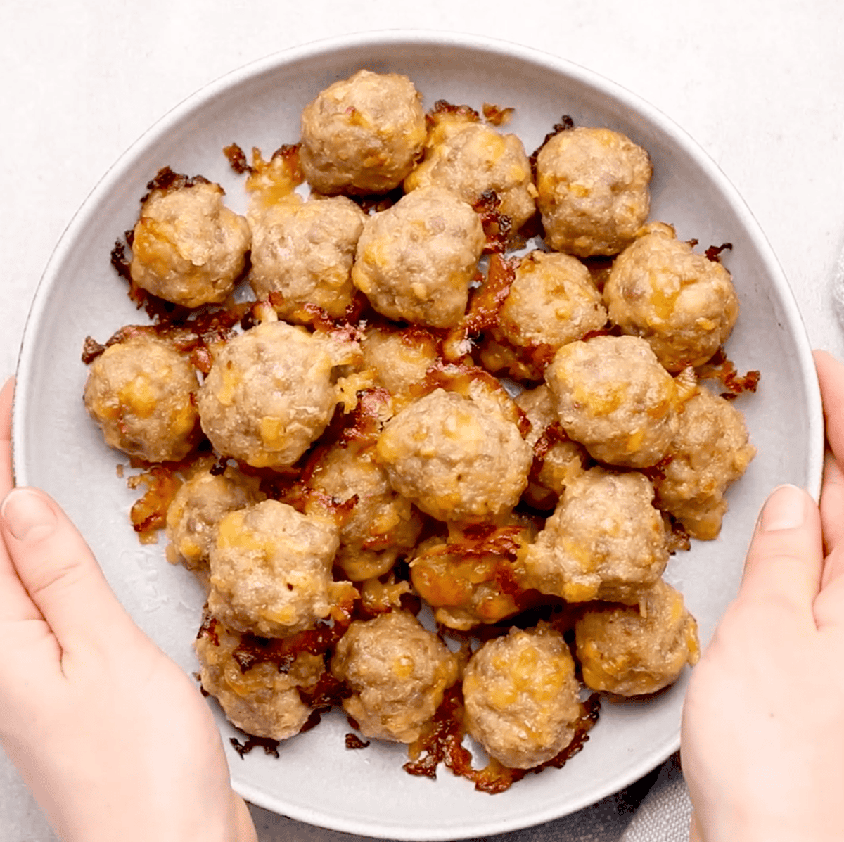 overhead image of a plate of cooked sausage balls