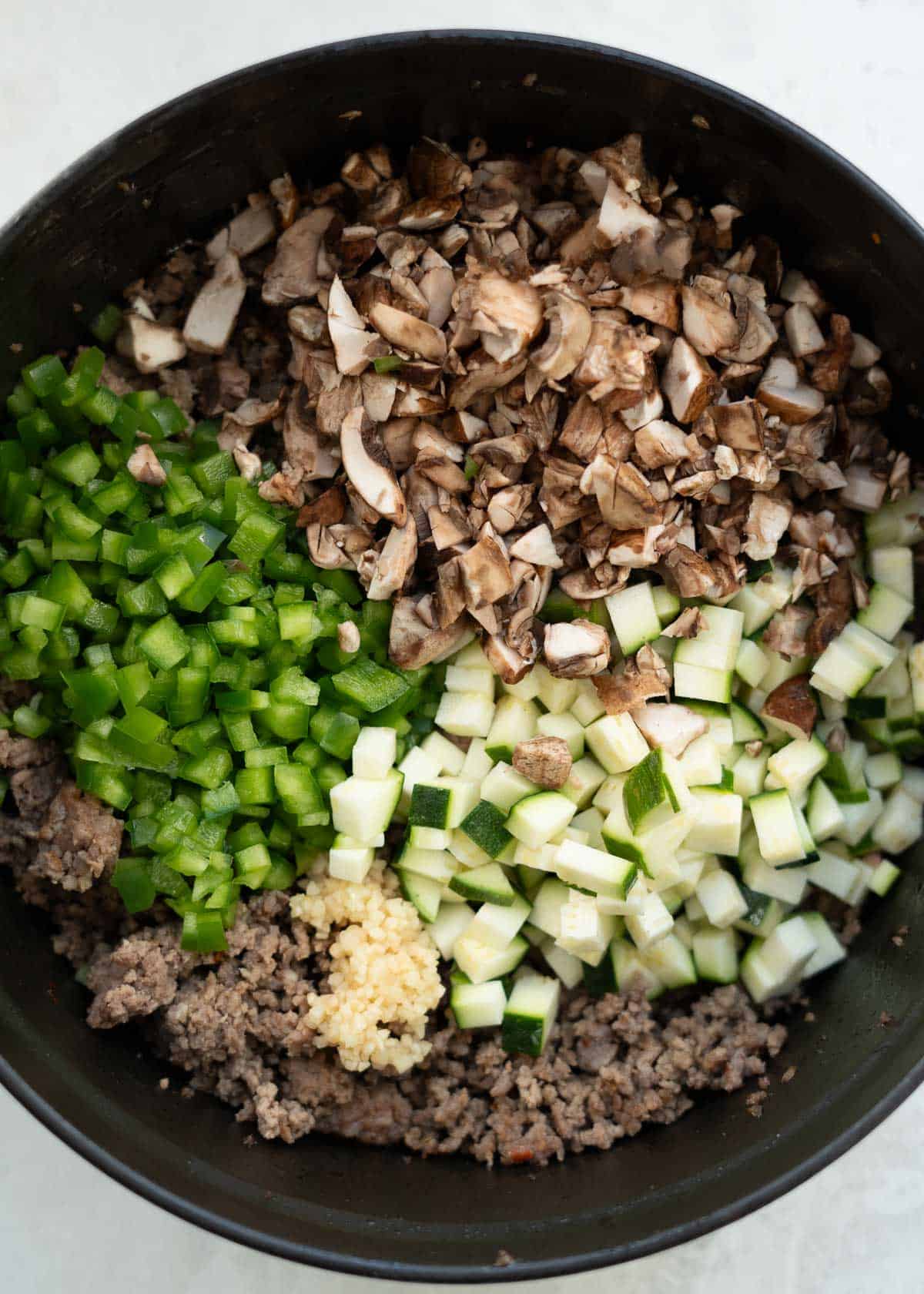 pizza soup ingredients in a dutch oven