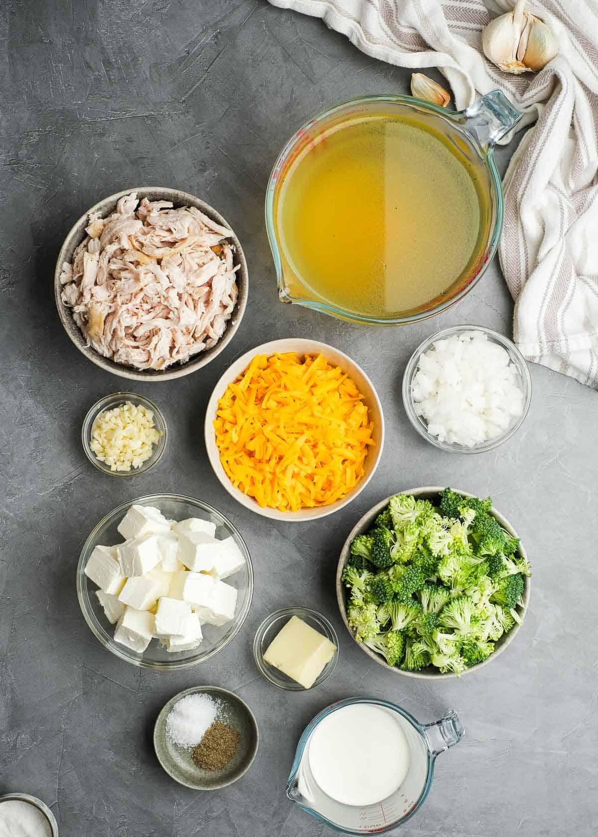 broccoli cheddar chicken soup ingredients on a gray table