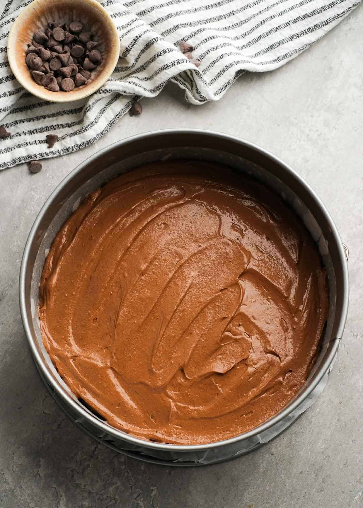 cake mixture being added to pan