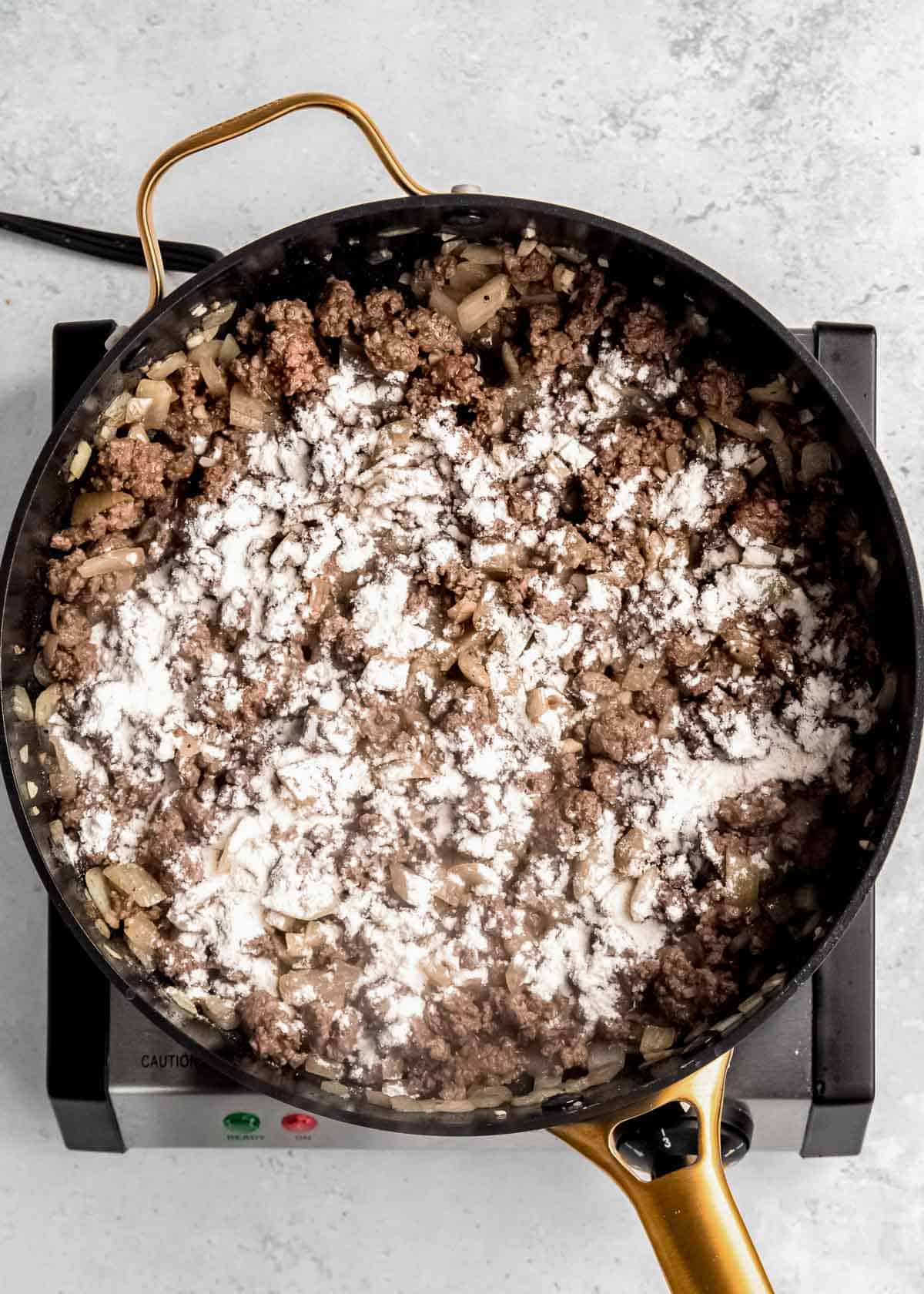 ground beef in a cast iron skillet