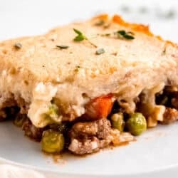 side image of a slice of keto shepherd's pie on a white plate