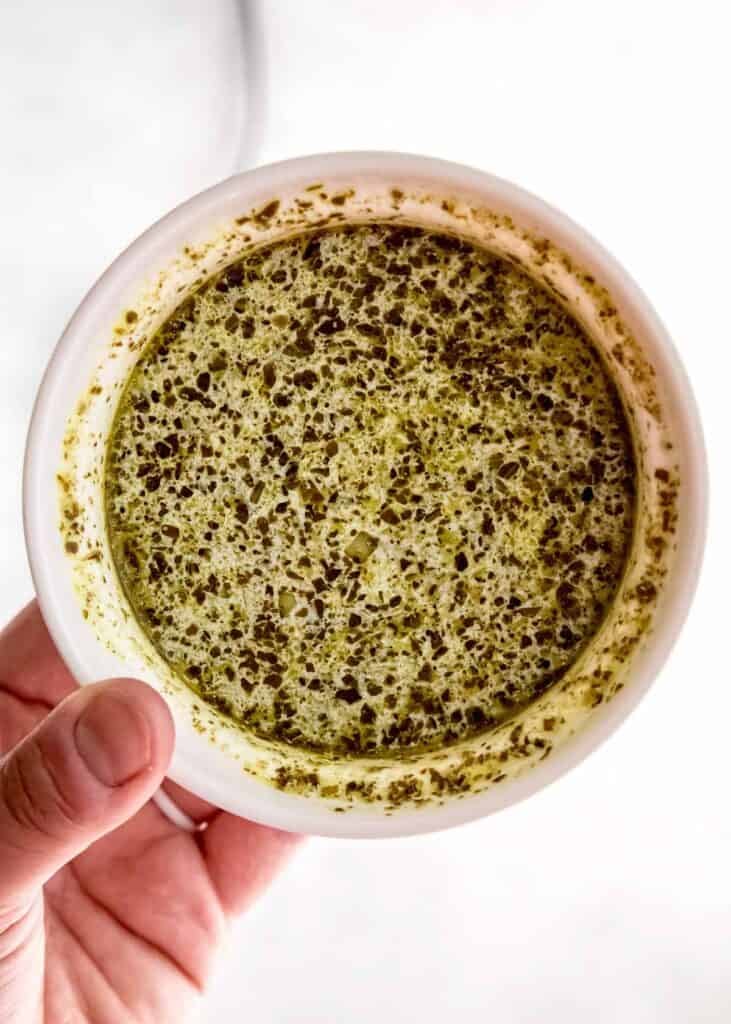 overhead image of pesto sauce in mixing bowl