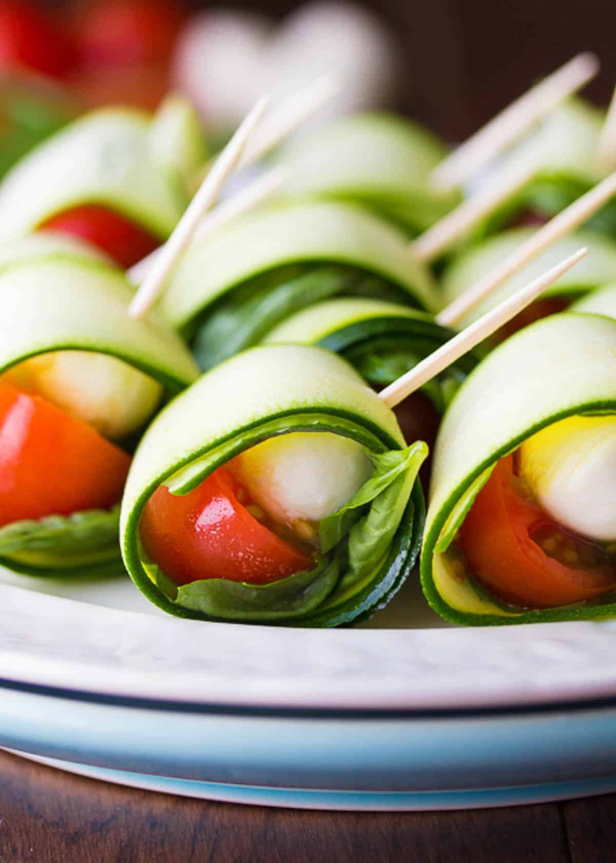 close up image of Caprese skewers on a white plate