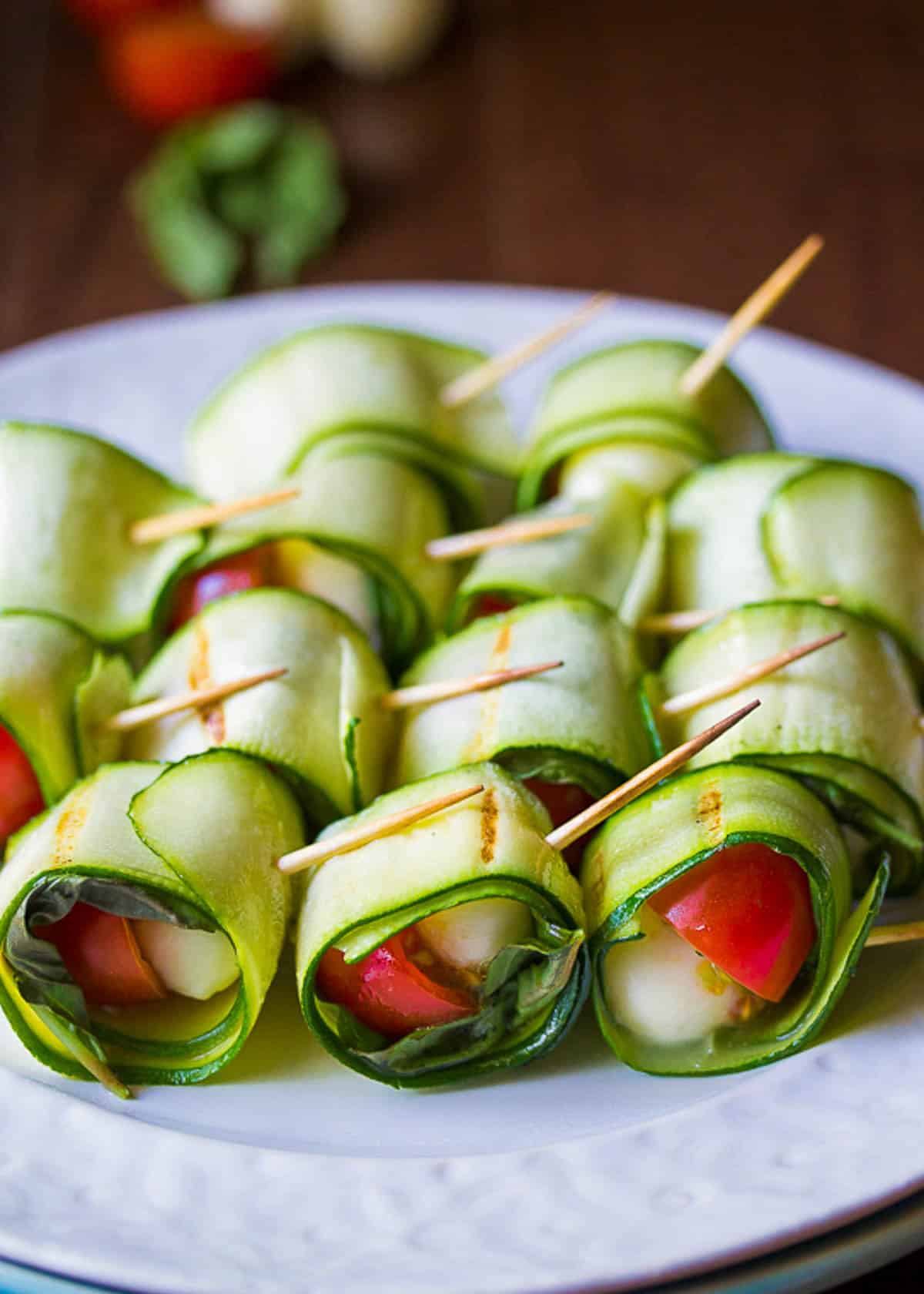 grilled Caprese skewers on a white plate