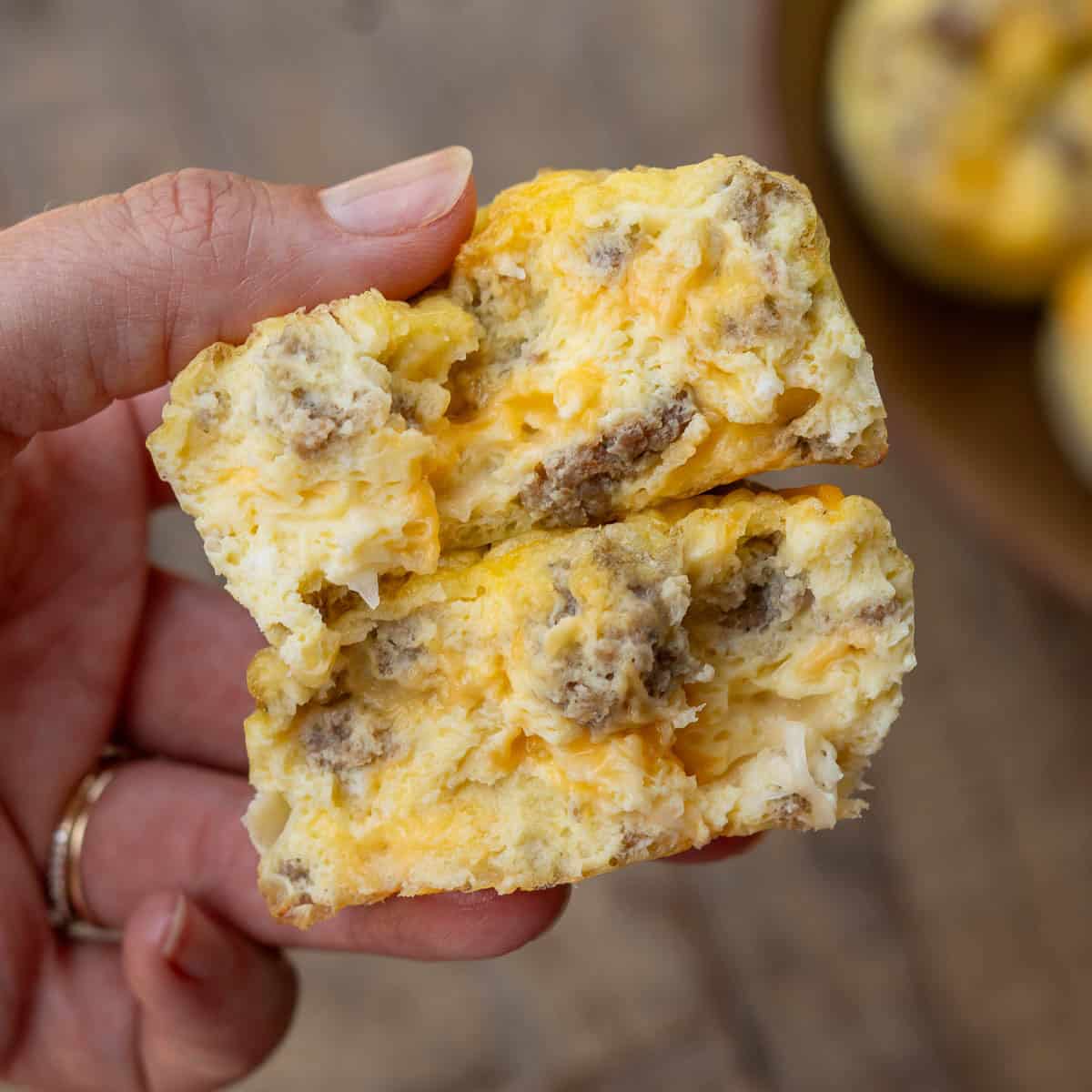 close up image of two egg muffins being held in hand