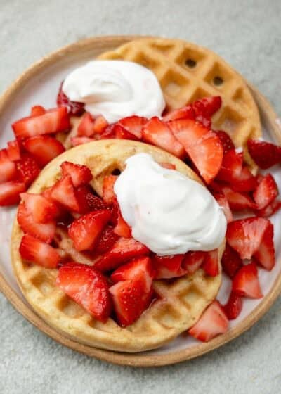 Strawberry waffles with whipped cream.