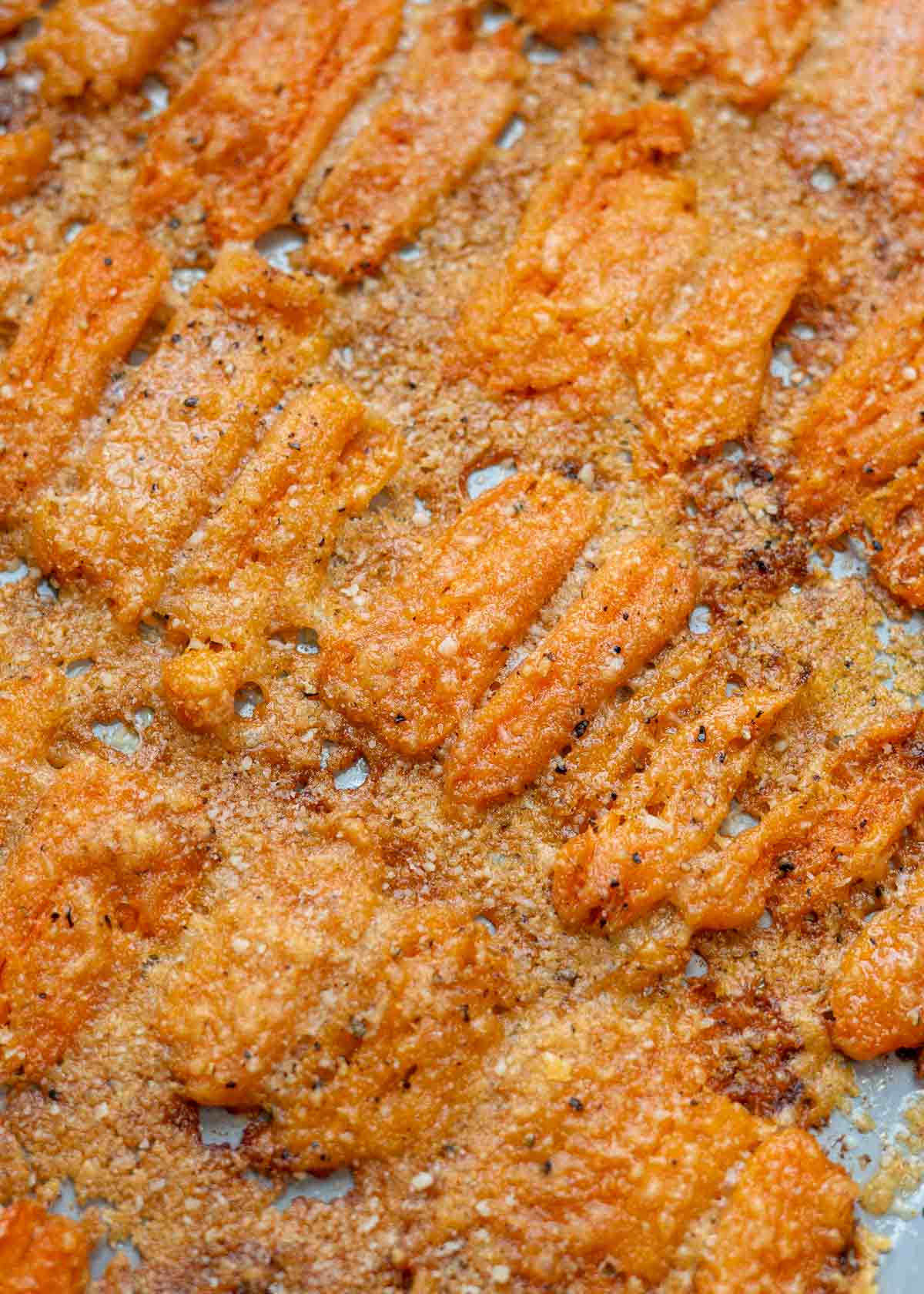 close up smashed carrots on sheet pan
