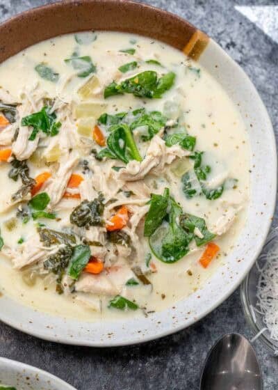 overhead image of chicken florentine soup in a white bowl