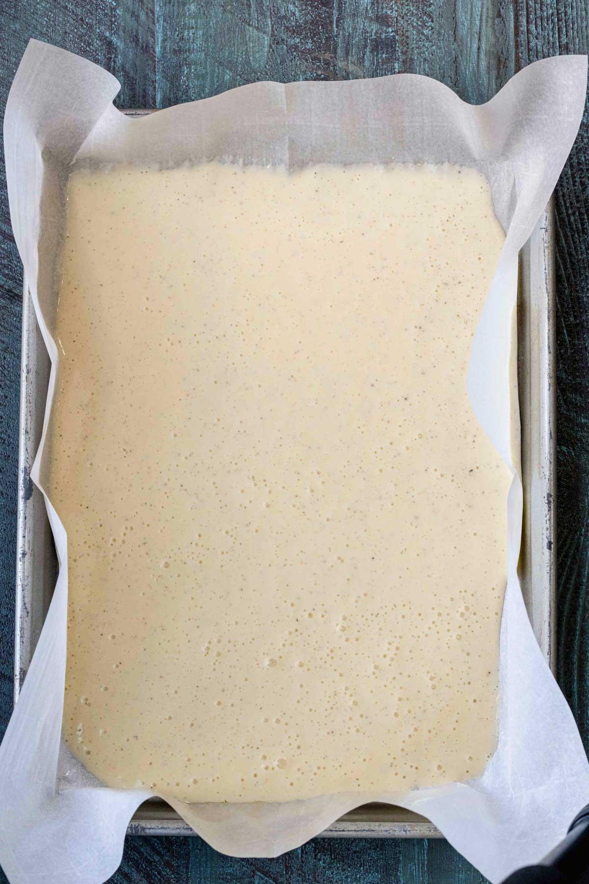 cottage cheese flatbread in sheet pan before being placed in oven