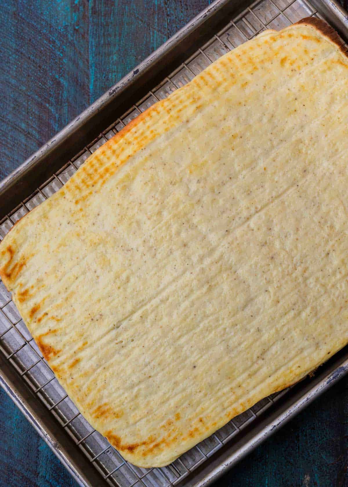 cottage cheese flatbread in sheet pan after being removed from oven