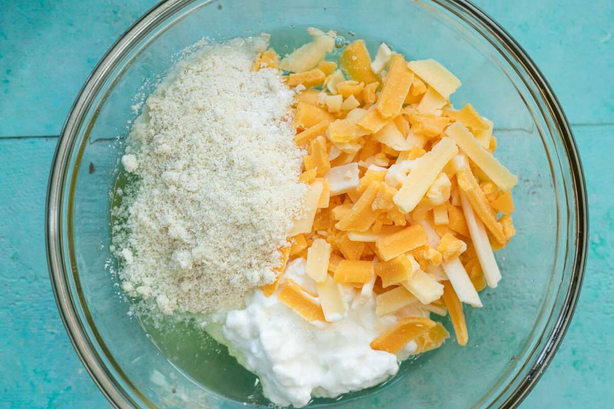 high protein waffle ingredients in a clear mixing bowl