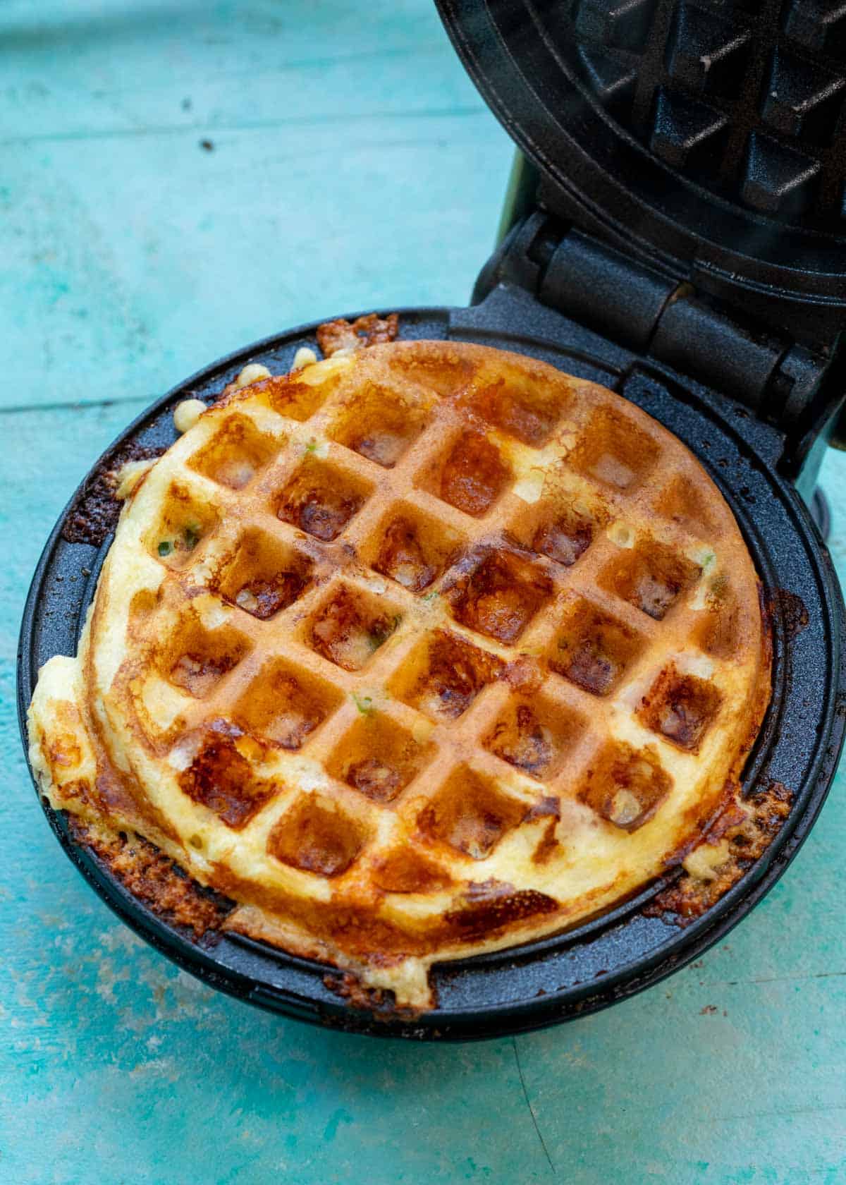 cooked high protein waffle in waffle maker prior to being removed