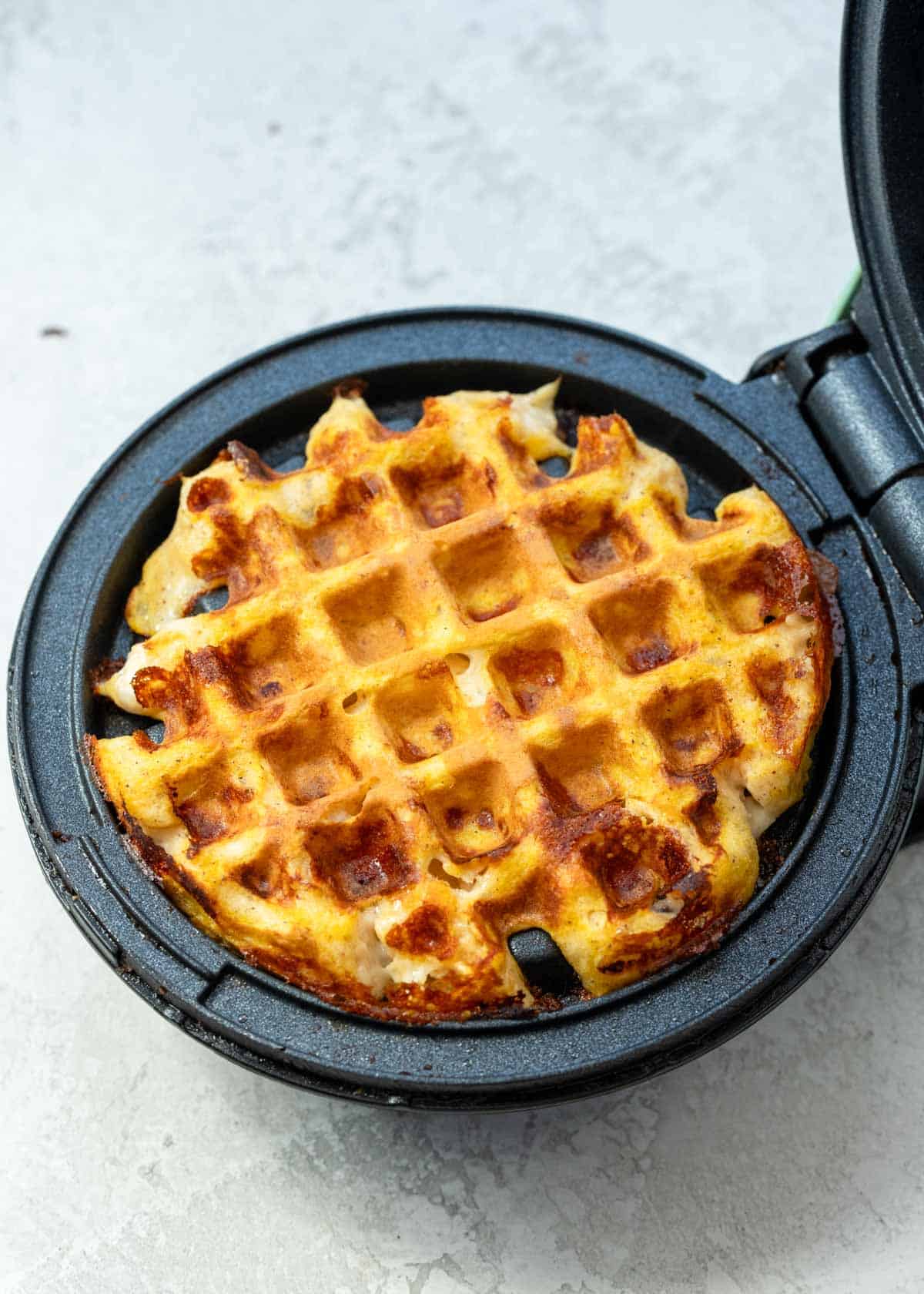 cooked pumpkin chaffle before being removed from waffle maker