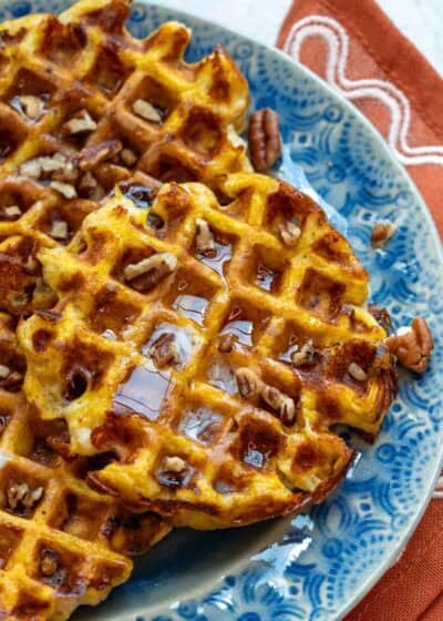 close up, overhead image of pumpkin chaffle on blue plate