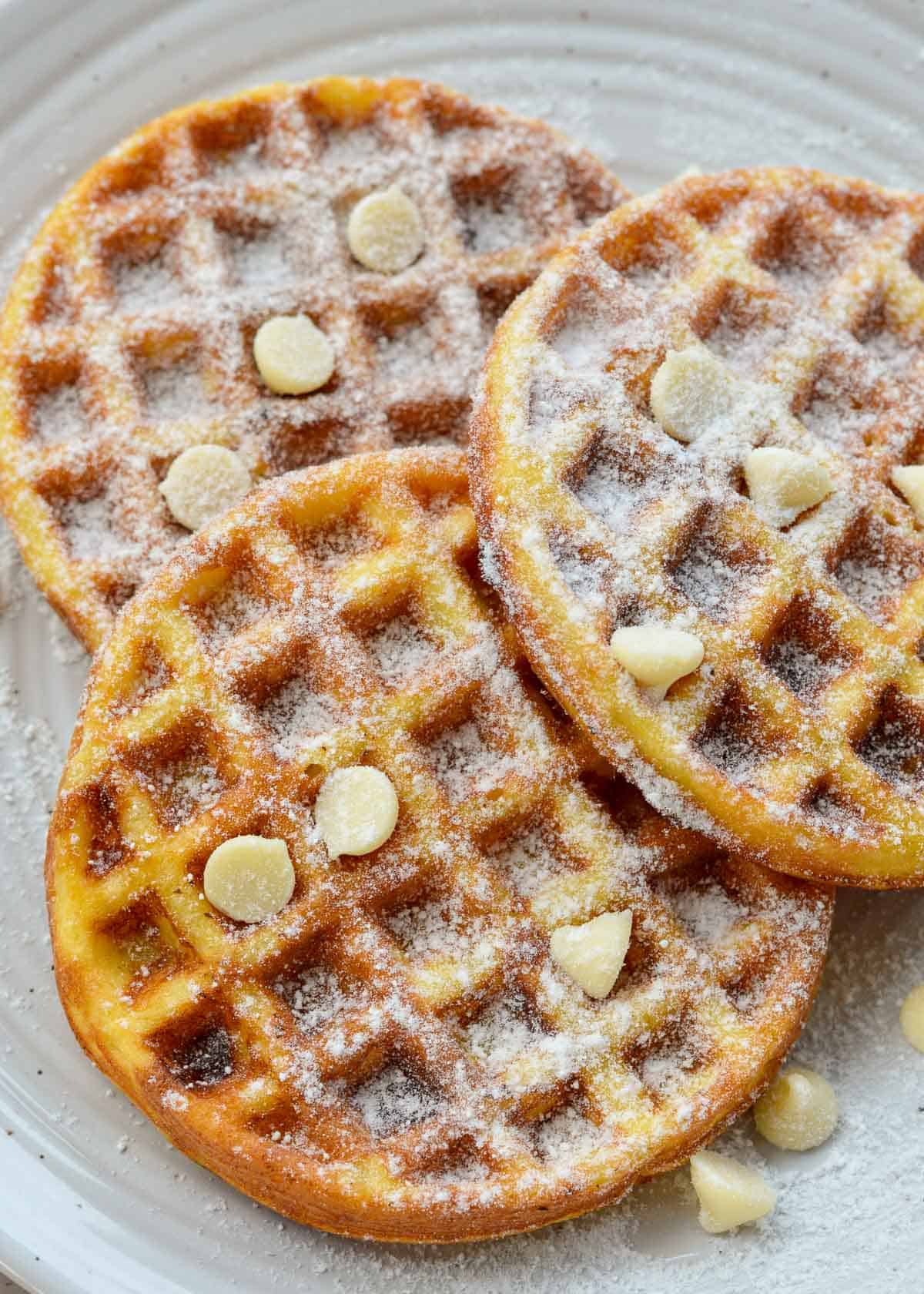 three sweet chaffles with white chocolate chips on a plate