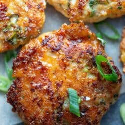 close up image of a broccoli cheddar chicken fritter on a stone cutting board