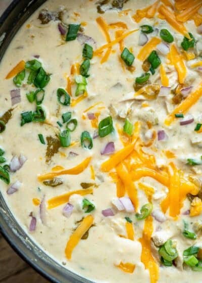 chicken soup with green chiles in a black dutch oven