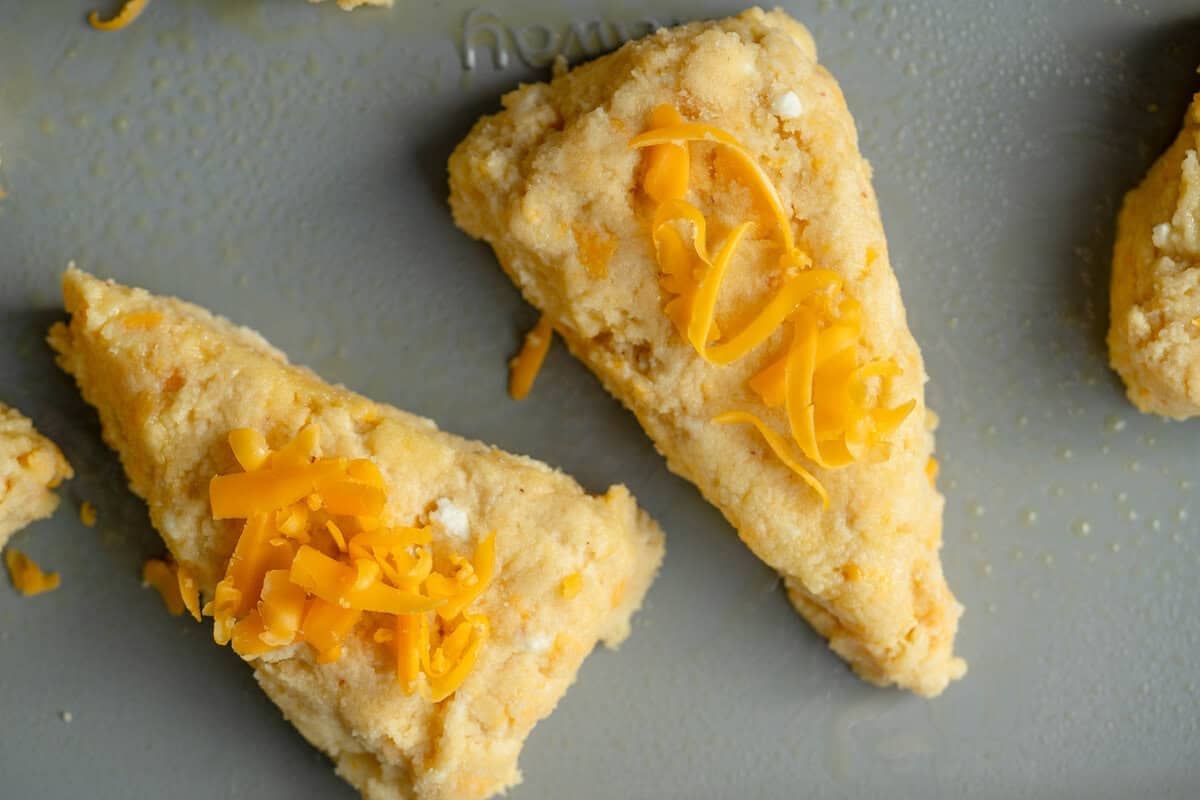 sliced gluten free scone dough on a baking sheet