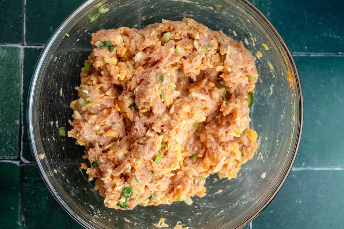 buffalo chicken fritter ingredients after being mixed in mixing bowl