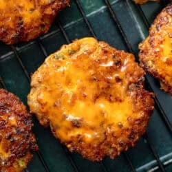 close up overhead image of a buffalo chicken fritter on a cooling rack