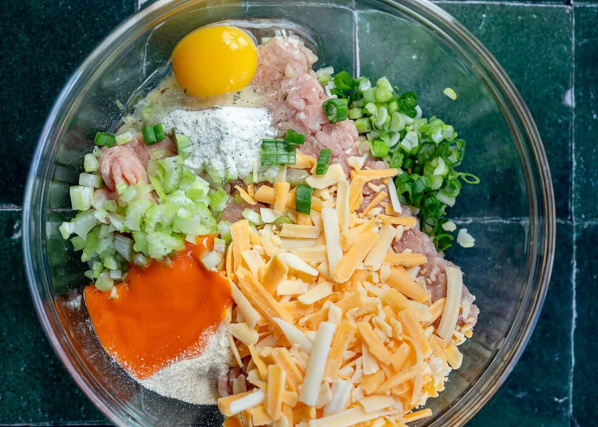 buffalo chicken fritter ingredients in mixing bowl