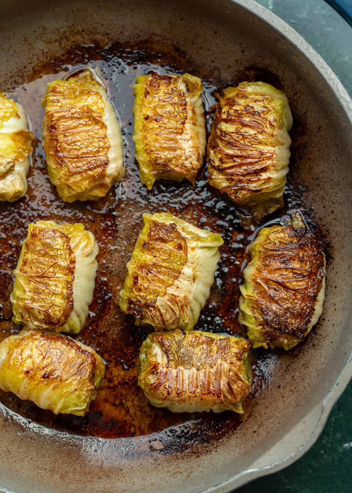 overhead image of pork dumplings being cooking in a skillet