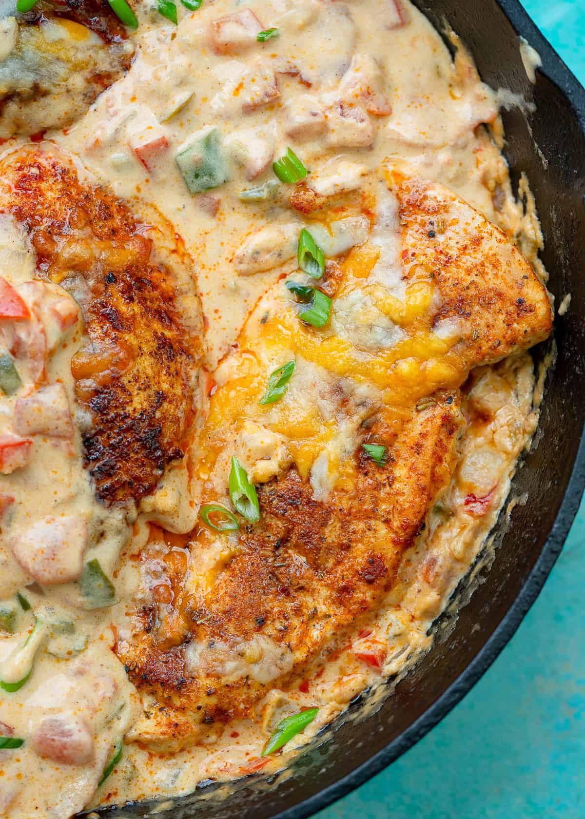 overhead image of cooked santa fe chicken in a black cast iron skillet