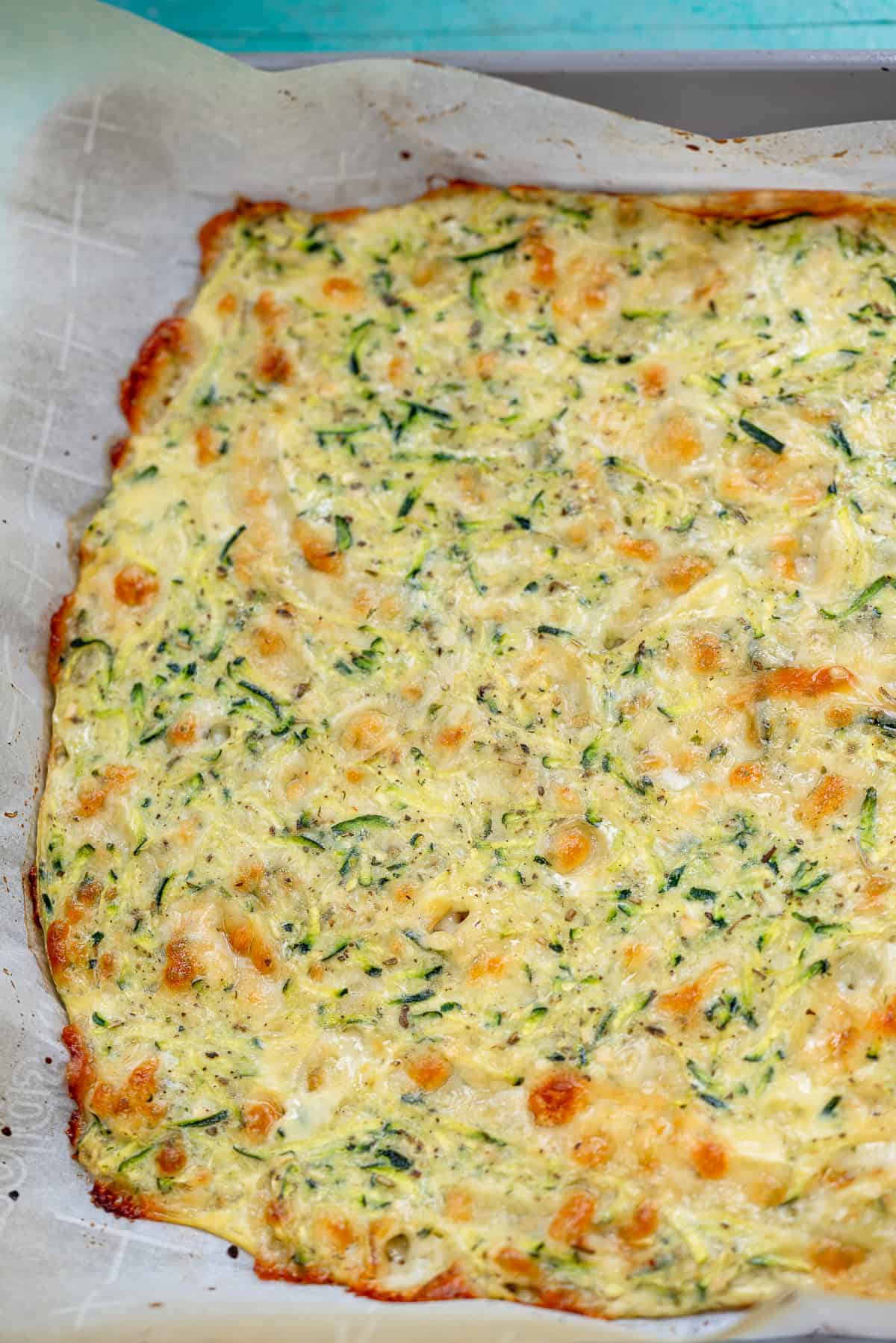 cooked zucchini breadsticks before being sliced and topped with final coating of cheese