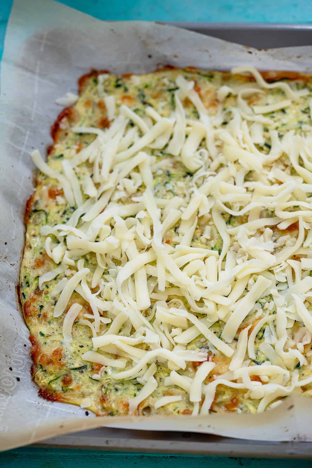 cooked zucchini breadsticks after being topped with final coating of cheese
