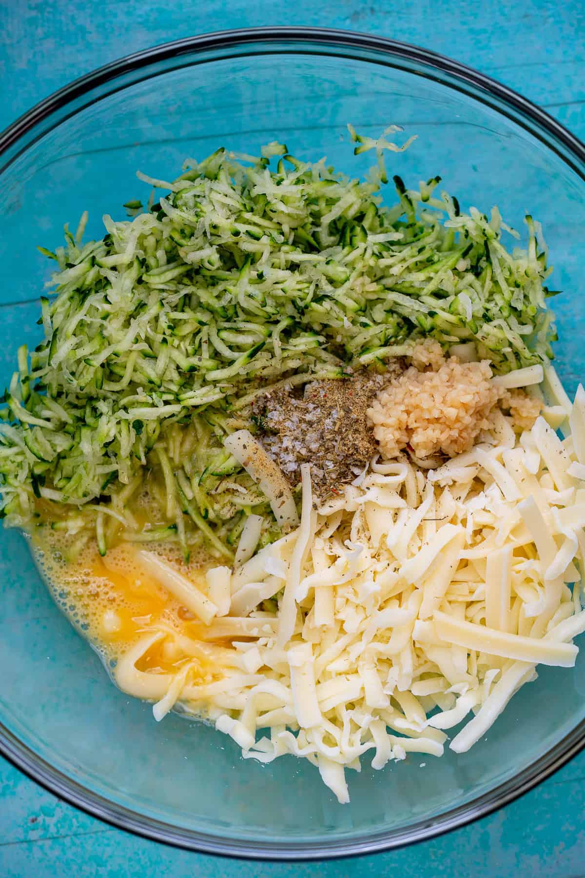 zucchini breadstick ingredients in a clear mixing bowl