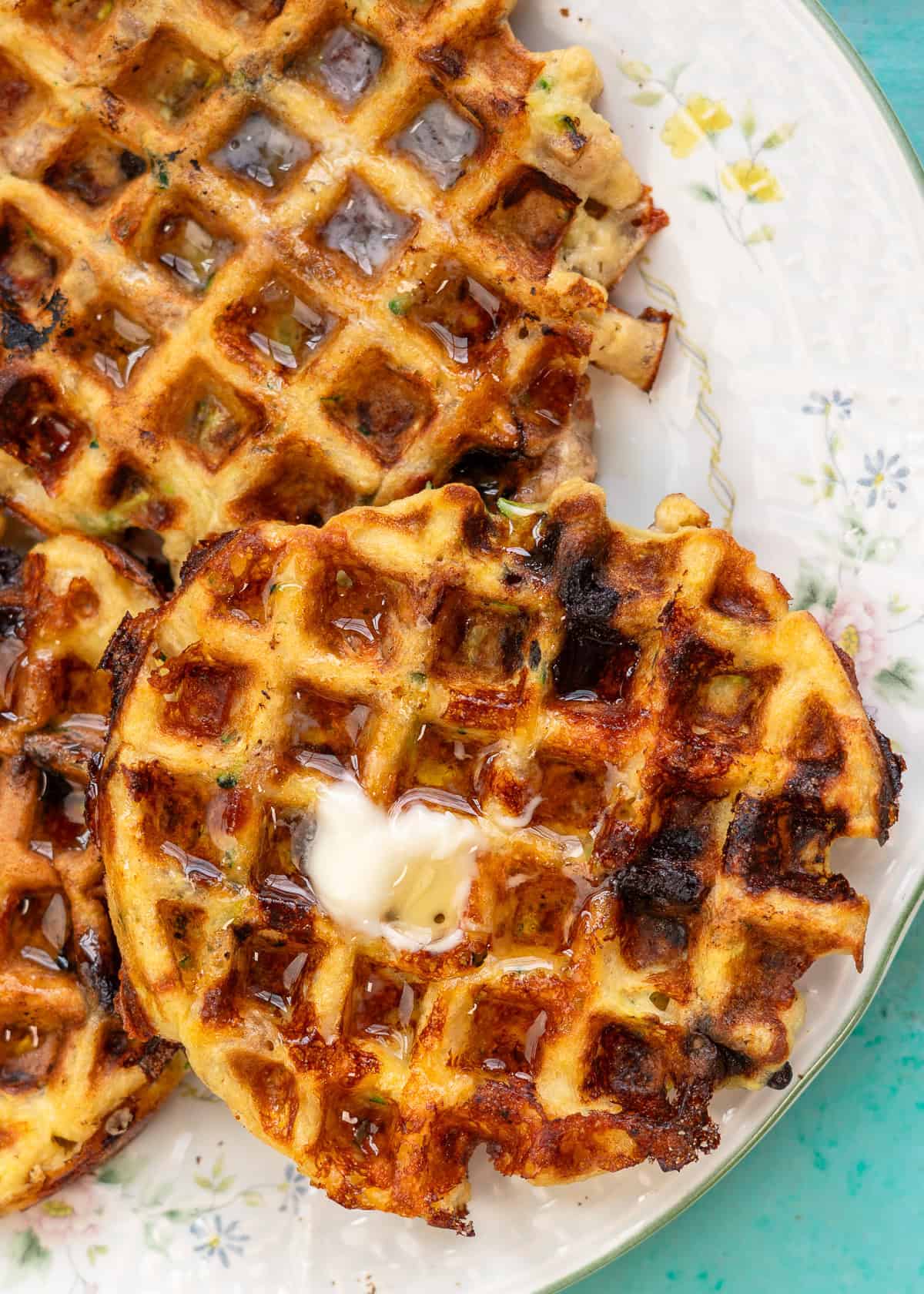 overhead image of zucchini bread chaffle on a white plate