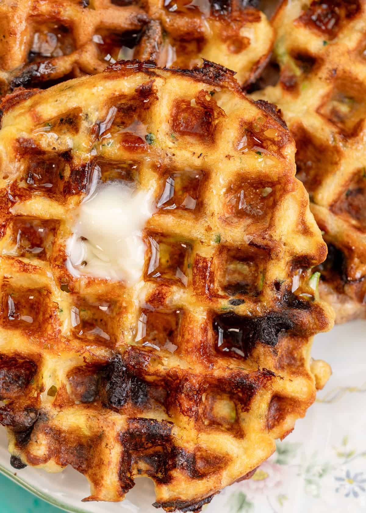 close up image of butter melting on a zucchini bread chaffle