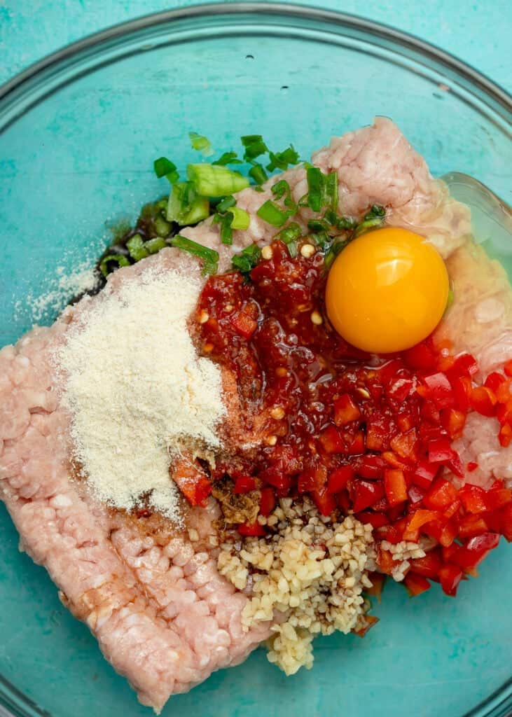 ingredients for asian chicken fritters in a bowl