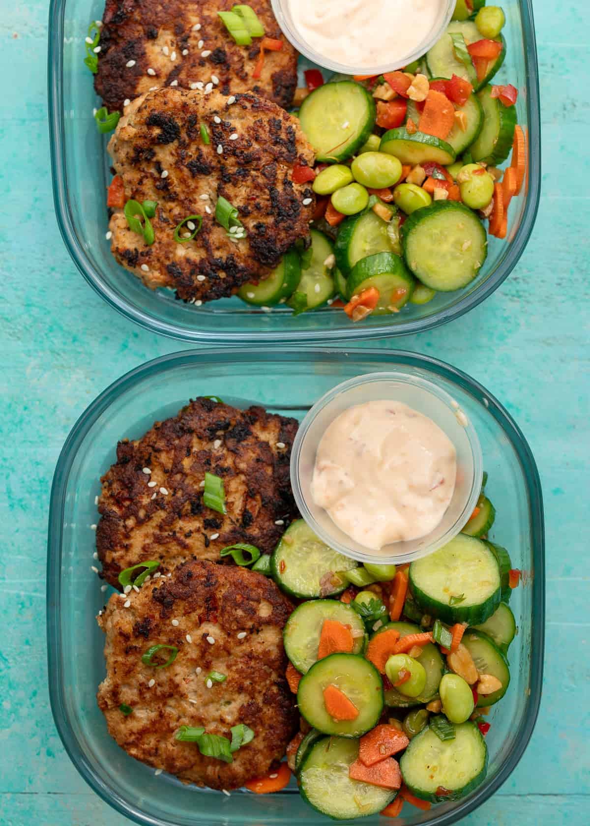 overhead image of asian chicken fritters in meal prep containers