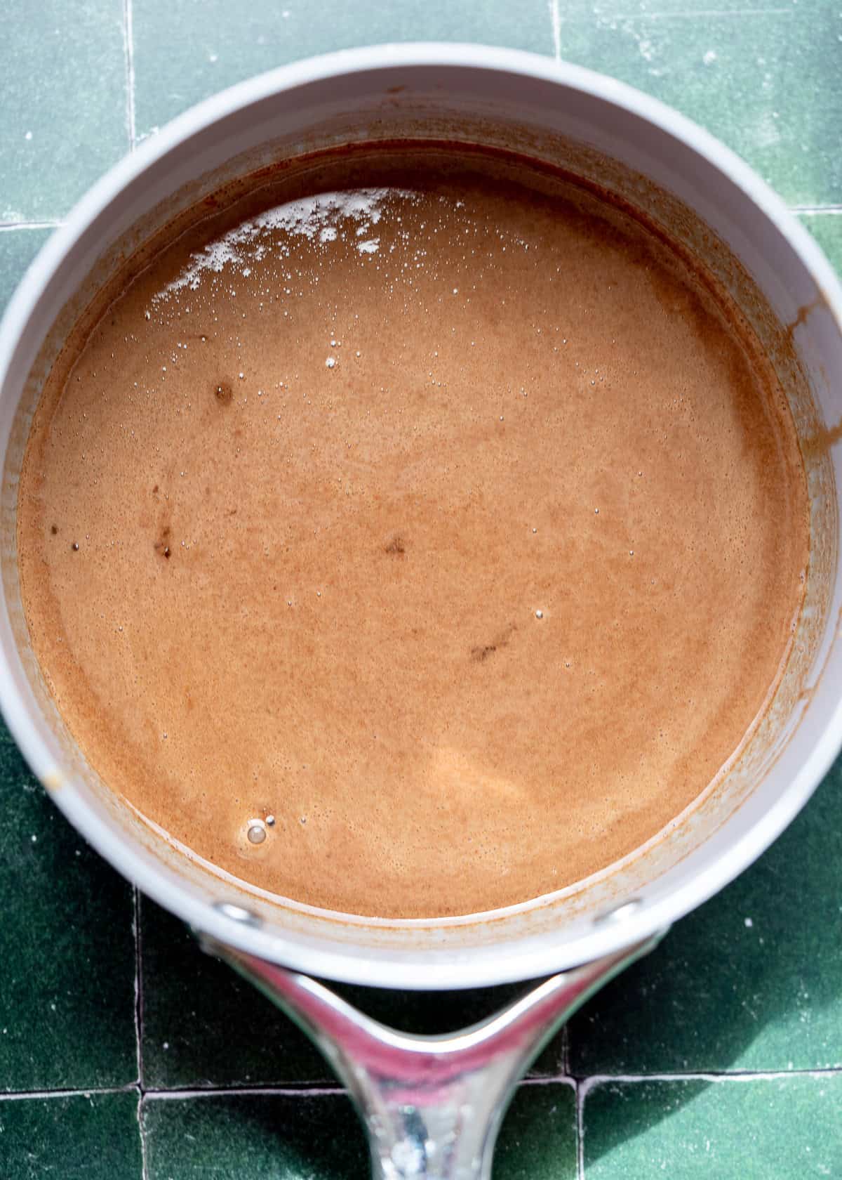 coconut oil and and almond butter melted in a sauce pan