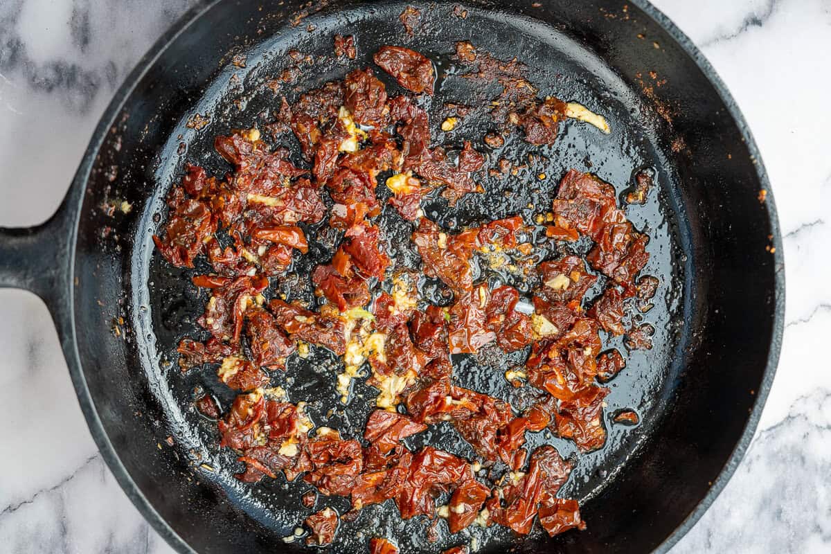 sun dried tomatoes in a cast iron skillet